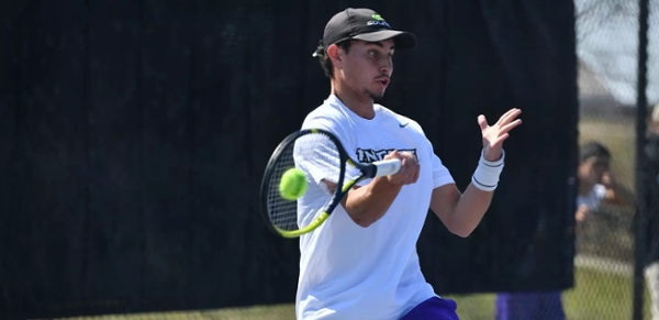 Knights men's tennis player performs during a match.